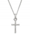 Give the gift of faith dusted with sparkling Swarovski crystal. This traditional cross pendant features round-cut crystal accents on the cross and bail. Crafted in silver tone mixed metal. Approximate length: 15-1/2 inches. Approximate drop: 1-1/2 inches.