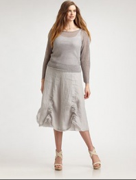 Add this airy, linen knit top to your wardrobe for a relaxed and flattering fit. It is the quintessential, lightweight layering piece. BoatneckThree-quarter sleevesPull-on styleRelaxed fitRibbed trimAbout 25 from shoulder to hem72% linen/28% nylonMachine washImported