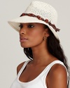 Make a statement lounging by the pool in an open crochet fedora accented by wooden beads and a brown belt.