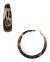 Take your jewelry box in a wild direction with Kenneth Jay Lane's hoop earrings. In a ladylike leopard-print, this pair gets spotted with an all-black palette and heels.