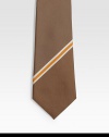 A wardrobe essential in silk made elegant with a diagonal stripe.SilkDry cleanMade in Italy