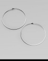 Make a quiet statement in these elegant hoop earrings. Silvertone metalLength, about 2.25Post closureImported 
