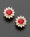 Royalty-inspired rubies. These petite floral-shaped earrings feature round-cut rubies (5/8 ct. t.w.) surrounded with sparkling round-cut diamond petals (1/4 ct. t.w.). Earrings crafted in 14k gold. Approximate diameter: 1/4 inch.
