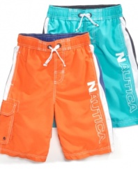 Color splash. With one of these bright, bold swimsuits from Nautica he'll stand out in the surf this summer.