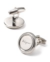 An off the cuff look in polished palladium, this round cufflink sports Salvatore Ferragamo's logo across the front.