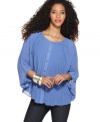 In a pleated silk chiffon, this MM Couture relaxed blouse adds on-trend volume to the season's skinny jeans!