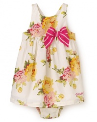 Juicy Couture's lovely poplin dress is rendered in large flower print, with ruffles from the empire waist and a big striped bow at the side.