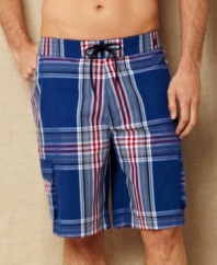 Pop in some plaid at la playa with these swim trunks from Nautica for a preppy summer beach look.