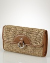 Crafted from textured straw and trimmed in leather, this clutch from Lauren Ralph Lauren is designed to add a globally-inspired touch to every look. The compact style is chic and capable of carrying the essentials.