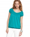 Smocked trim adds a ruffled, feminine flair to this Studio M top -- pair it with your fave summer bottoms!