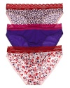 A solid or printed bikini with contrast scalloped lace trim along waistline.