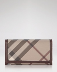 Burberry's iconic check print in muted neutrals lends sophisticated style to this leather trimmed continental wallet.