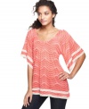A pretty print and enchanting lace trim decorate a free-flowing top from Cha Cha Vente!