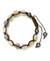 Spiritual-inspired bracelets are all the rage this season! Snap up this hot style from Ali Khan featuring semi-precious honey agate beads and pave glass fireballs on a trendy brown cord. Bracelet adjusts to fit the wrist. Approximate diameter: 2 inches. Approximate length: 12-1/4 inches.