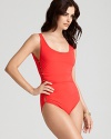 While it may seem simple on the surface, this Carmen Marc Valvo swimsuit boasts side cutouts and gold-tone bead accents.