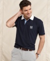 Tee up with classic style wearing this polo shirt from Tommy Hilfiger.