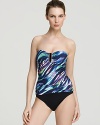 Vibrant stripes with electric appeal send sparks flying on this La Blanca one-piece swimsuit--a solid bottom gives the illusion of a two-piece suit.