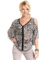 Answer the call of the wild in this chiffon, animal-print top that sports trend-right cutouts and bold attitude! From GUESS?.