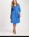 When you think of the quintessential combination of comfort and style, think about this shirtdress. It features a relaxed fit, courtesy of a touch of stretch and a feminine, curved hem.Split neckButton-tab sleevesBust dartsCurved hemAbout 25 from natural hem97% cotton/3% spandexDry cleanMade in USA of imported fabric