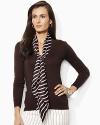The classic V-neck cardigan is updated with a detachable silk scarf at the neckline for a chic accent.