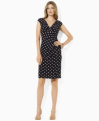 A shirred asymmetrical neckline and delicate ruching at the left hip lend an air of modern elegance to the slinky Lauren by Ralph Lauren dress, rendered in sleek matte jersey with a hint of stretch for a flattering fit.