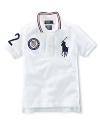 This preppy short-sleeve polo shirt in breathable cotton mesh celebrates Team USA's participation in the 2012 Olympics with the official U.S. Olympic Team logo and the Big Pony at front and London embroidery at the back.