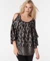 Shoulder cutouts add edge to this mixed-printed MM Couture tunic that's perfect for an easy evening look!