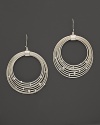 Brilliant diamonds accent concentric sterling silver circles in India Hicks' Tread hoop earrings.