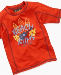 He'll play freely in the surf and sand when he's protected by this rash guard from iXtreme.