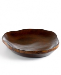 Hand-carved in fast-growing obeche wood, this rustic platter is an ode to the Haitian mountainside and designed by Haiti's master woodwork artist, Einstein Albert. A unique centerpiece on your table, it's a beautiful way to serve fruit, cheese and more.