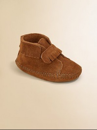 Classic moccasin stitching, fringe and an easy on/easy off grip-tape strap make this plush suede pair a must-have for baby.Grip-tape strap closureSuede upperSuede solePadded insoleImported