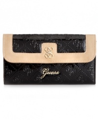 A pretty patent look that brings the shine. This slim clutch design from GUESS keeps your essentials organized in chic style. Ideal for the everyday.