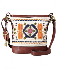 Inspired by Italian bags from the '70s, this classic carryall by Fossil evokes the feeling of an evening stroll through Piazza Navona. Unique floral embroidery, brass-tone hardware and sturdy leather shoulder strap make it the essential everyday accessory.