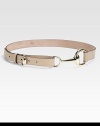 A stylish leather belt with light gold hardware and requisite horsebit buckle.About 1 wideMade in Italy 