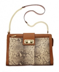 Get noticed in this striking python print shoulder bag from BCBGMAXAZRIA. A luxe chain strap, contrast trim and chic silhouette will bring a posh appeal to any ensemble.