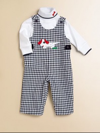 A charming one-piece in an overall design with a check pattern and puppy appliqué.ScoopneckShoulder straps with button closureSide buttonsBottom snaps65% cotton/35% rayonDry cleanImported Please note: Number of buttons and snaps may vary depending on size ordered. 