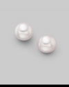 From the Akoya Collection. Classic white cultured pearl studs set in 18k gold. 7mm white round cultured pearls Quality: A 18k white gold Post back Imported