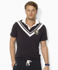 Designed in washed cotton jersey for a timeworn look and feel, a trim-fitting rugby shirt captures the timeless sensibility of vintage sportswear with preppy chevron stripes and bold embroidery.