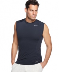 In motion. Stay going strong with this fitted sleeveless t-shirt from Nike featuring Dri-Fit technology.