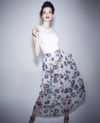 Boldly spring, an allover floral print adds feminine charm to this Alberta Ferretti maxi skirt!