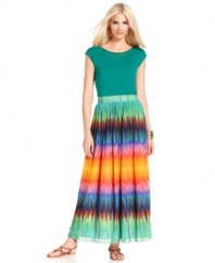 A palette of vibrant, eye-catching colors brightens up Vince Camuto's floaty maxi skirt. A solid top and strappy flat sandals showcase the vivid ombre effect.