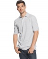 Straighten out your casual cool style with this striped polo shirt from Izod.