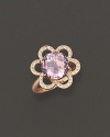 Pavé diamonds blossom around a 18K gold flower, centered with faceted rose of France. By Carelle.