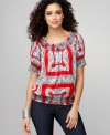 Go for the bold! Style&co.'s essential peasant top pops with a vibrant print.