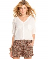 Modernize your warm-weather gear with this asymmetrical, back cutout blouse from Jessica Simpson!