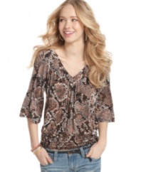 Incorporate a wild design into your stock of cool tops with this snakeskin-print style from American Rag!