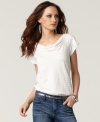 The simple tee gets revamped with metallic stripes and a cute draped neckline in this look from Calvin Klein Jeans!