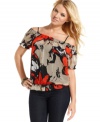 Rock chic, senorita style by day in this top from GUESS?: a medley of bold print, blouson fit and shoulder-baring design!