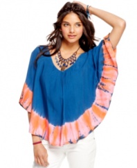 Crisscross back straps and a tie-dye trim make for a fusion of cool design on this poncho from American Rag -- where comfy-cute meets urban boheme!