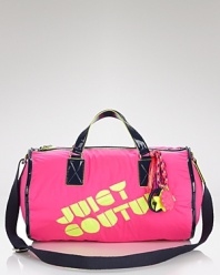 Glam to-go. Juicy Couture makes a bold statement with patent leather handles, neon lining and signature charms dangling from a multicolor chain.